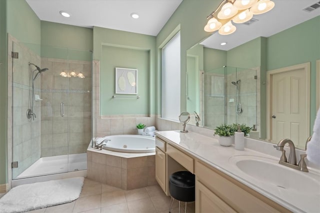 2418 Silent Brook Trl, Round Rock, TX 78665 - bathroom featuring a stall shower, tile patterned floors, a jetted tub, and vanity