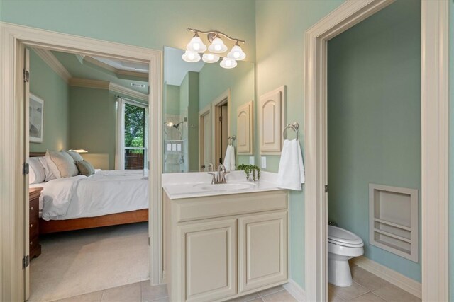 2418 Silent Brook Trl, Round Rock, TX 78665 - full bathroom with connected bathroom, ornamental molding, vanity, toilet, and tile patterned flooring