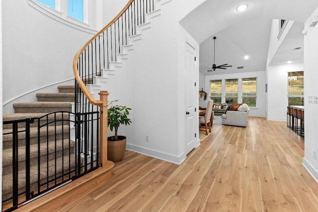1016 Willie Ranch Way, Leander, TX 78641 - stairway with hardwood / wood-style floors, a ceiling fan, baseboards, high vaulted ceiling, and recessed lighting