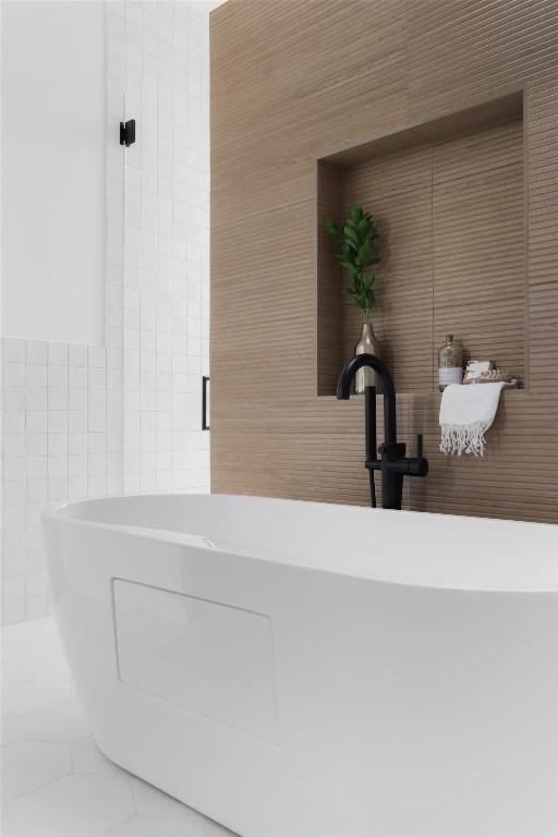 2709 Addison Ave, Austin, TX 78757 - full bathroom with tile walls and a soaking tub