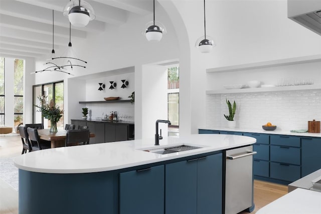 2709 Addison Ave, Austin, TX 78757 - bar with backsplash, pendant lighting, beam ceiling, and a sink