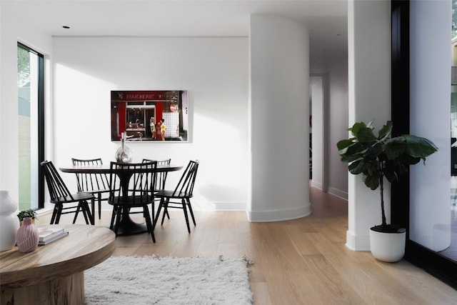 2709 Addison Ave, Austin, TX 78757 - dining space with baseboards and wood finished floors