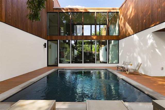 2709 Addison Ave, Austin, TX 78757 - rear view of property with an outdoor pool and a deck