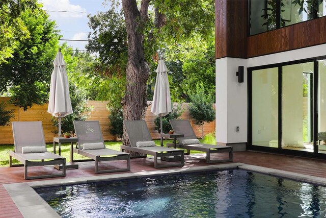 2709 Addison Ave, Austin, TX 78757 - view of pool with a wooden deck, fence private yard, and a fenced in pool