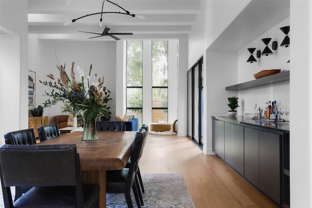 2709 Addison Ave, Austin, TX 78757 - dining space with light wood-type flooring and beam ceiling