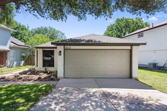 8121 Almondsbury Ln, Austin, TX 78748 - view of front of house featuring brick siding, driveway, a shingled roof, and a garage