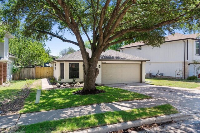 8121 Almondsbury Ln, Austin, TX 78748 - view of front of property with an attached garage, concrete driveway, and central AC