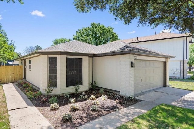 8121 Almondsbury Ln, Austin, TX 78748 - view of property exterior with a garage, brick siding, concrete driveway, and roof with shingles
