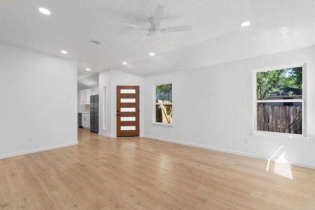 8121 Almondsbury Ln, Austin, TX 78748 - unfurnished living room with plenty of natural light, a ceiling fan, light wood-style floors, and recessed lighting