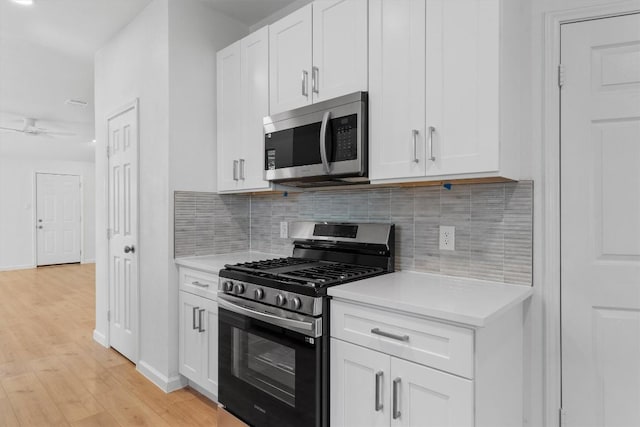 8121 Almondsbury Ln, Austin, TX 78748 - kitchen with appliances with stainless steel finishes, light countertops, tasteful backsplash, and light wood-style floors