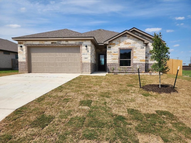 view of front of house featuring concrete driveway, an attached garage, brick siding, and a front yard