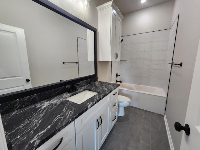 bathroom featuring vanity, recessed lighting, washtub / shower combination, and toilet