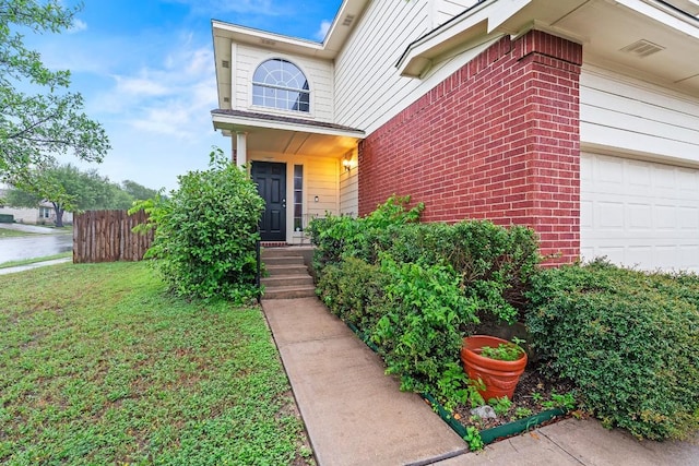 400 W Tudor House Rd, Pflugerville, TX 78660 - view of exterior entry featuring brick siding