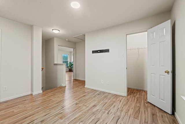 400 W Tudor House Rd, Pflugerville, TX 78660 - unfurnished bedroom featuring light wood-type flooring, a spacious closet, and a closet