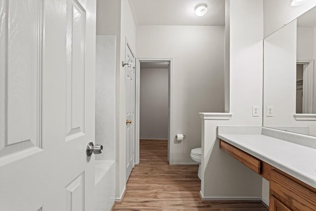 400 W Tudor House Rd, Pflugerville, TX 78660 - bathroom featuring toilet, wood finished floors, and vanity