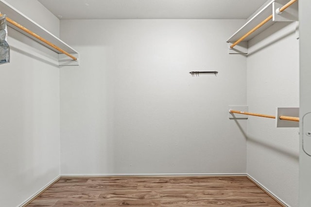 400 W Tudor House Rd, Pflugerville, TX 78660 - walk in closet with wood finished floors