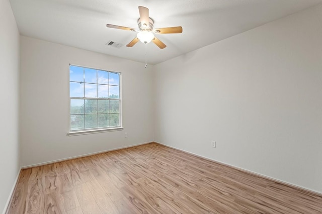 400 W Tudor House Rd, Pflugerville, TX 78660 - spare room featuring light wood-style floors, a ceiling fan, and baseboards