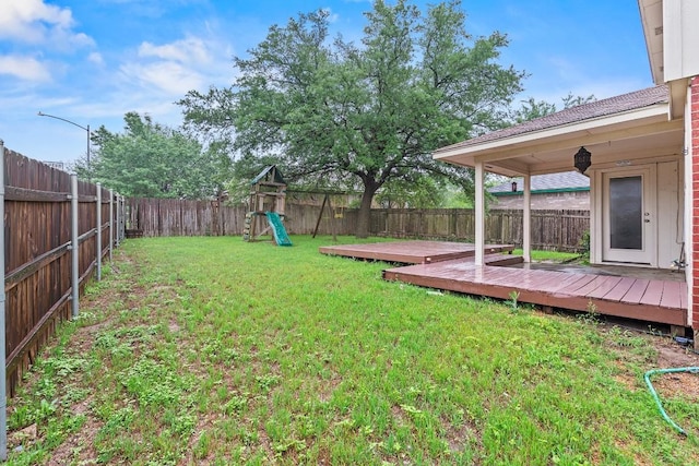 400 W Tudor House Rd, Pflugerville, TX 78660 - view of yard with a playground and a wooden deck