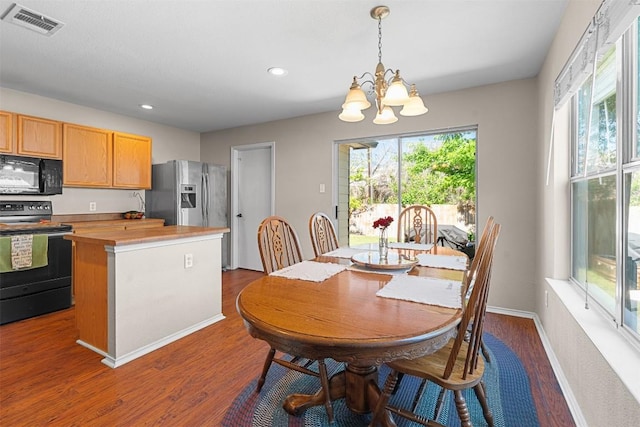 4302 Kings Canyon Dr, Taylor, TX 76574 - dining space with recessed lighting, dark wood-style floors, an inviting chandelier, visible vents, and baseboards