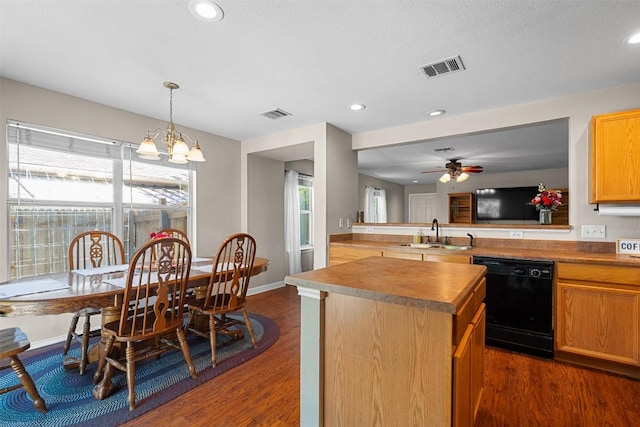 4302 Kings Canyon Dr, Taylor, TX 76574 - kitchen with dishwasher, visible vents, dark wood-style flooring, and a sink