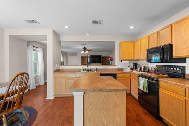 4302 Kings Canyon Dr, Taylor, TX 76574 - kitchen with black appliances, light brown cabinetry, a sink, and visible vents