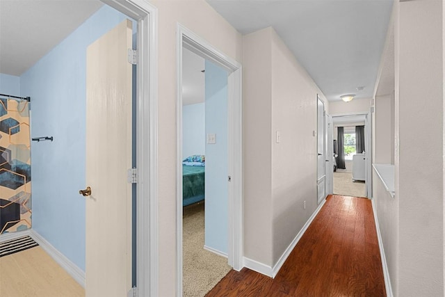 4302 Kings Canyon Dr, Taylor, TX 76574 - hallway featuring baseboards and wood finished floors