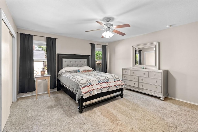 4302 Kings Canyon Dr, Taylor, TX 76574 - carpeted bedroom featuring ceiling fan, baseboards, multiple windows, and a closet