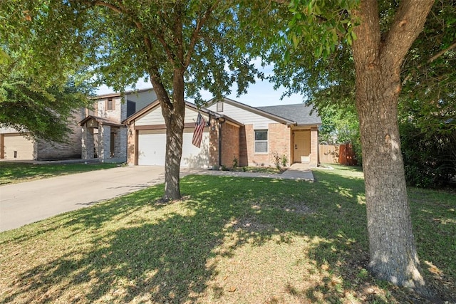 4302 Kings Canyon Dr, Taylor, TX 76574 - view of front facade with driveway, fence, brick siding, an attached garage, and a front yard
