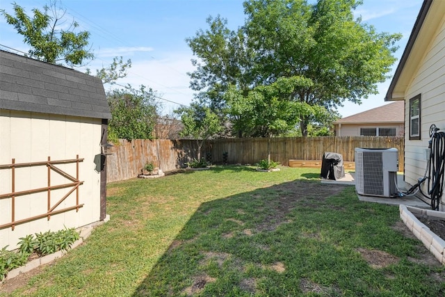 4302 Kings Canyon Dr, Taylor, TX 76574 - view of yard with a fenced backyard, an outbuilding, a storage shed, and central air condition unit