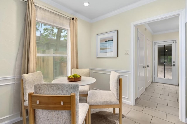 7313 Grover Ave, Austin, TX 78757 - dining space with ornamental molding, light tile patterned floors, recessed lighting, and a decorative wall