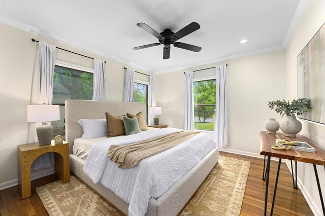 bedroom featuring recessed lighting, wood finished floors, crown molding, baseboards, and ceiling fan