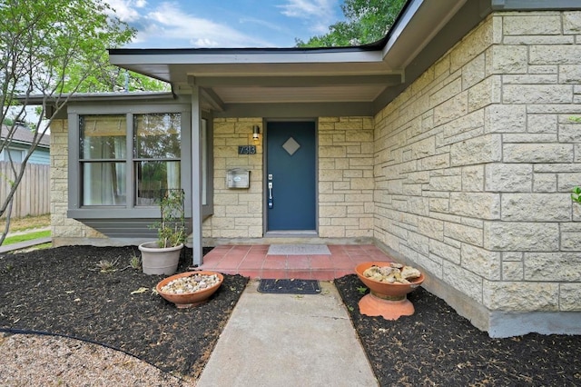 view of exterior entry with stone siding