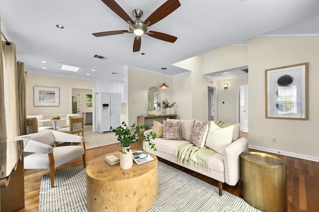7313 Grover Ave, Austin, TX 78757 - living area featuring a ceiling fan, light wood-type flooring, recessed lighting, and ornamental molding