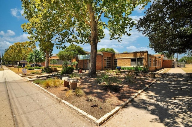 view of front of home with brick siding