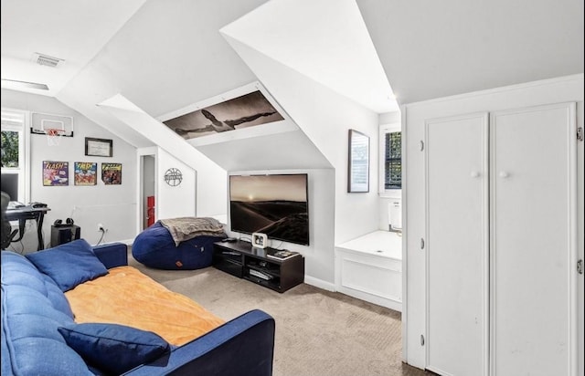 1606 W 14th St, Austin, TX 78703 - living area featuring carpet flooring, vaulted ceiling, and a skylight