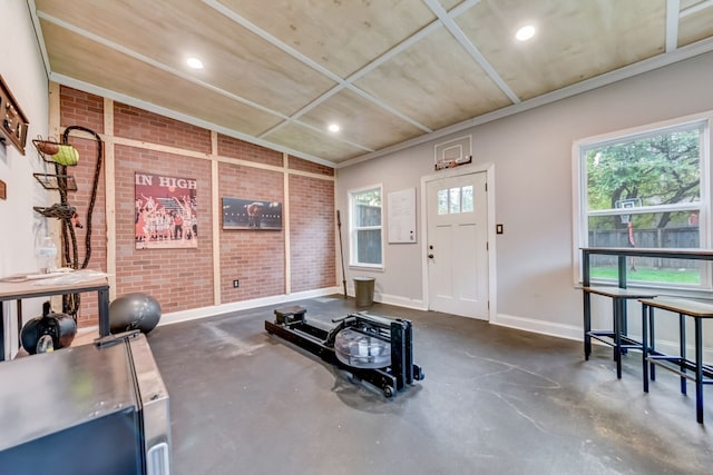 1606 W 14th St, Austin, TX 78703 - exercise room featuring baseboards, recessed lighting, and brick wall