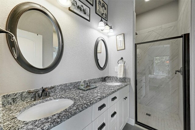 19908 Victoria Chase Rd, Lago Vista, TX 78645 - bathroom with double vanity and a shower stall