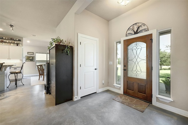 19908 Victoria Chase Rd, Lago Vista, TX 78645 - foyer entrance with finished concrete floors and baseboards