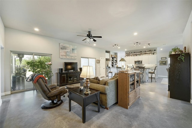 19908 Victoria Chase Rd, Lago Vista, TX 78645 - living area featuring concrete flooring, recessed lighting, and ceiling fan