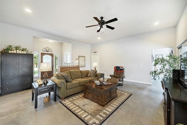 19908 Victoria Chase Rd, Lago Vista, TX 78645 - living area featuring finished concrete floors, ceiling fan, and recessed lighting