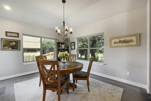 19908 Victoria Chase Rd, Lago Vista, TX 78645 - dining room featuring a chandelier, plenty of natural light, and finished concrete flooring