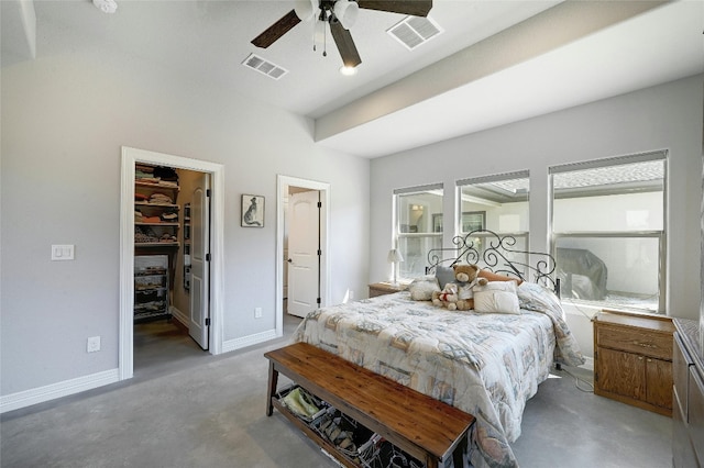 19908 Victoria Chase Rd, Lago Vista, TX 78645 - bedroom featuring a walk in closet, concrete flooring, a ceiling fan, and a closet