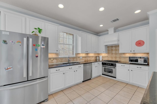 10020 Lachlan Dr, Austin, TX 78717 - kitchen featuring dark countertops, appliances with stainless steel finishes, a sink, and visible vents