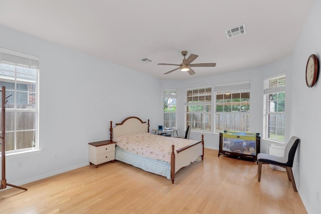10020 Lachlan Dr, Austin, TX 78717 - bedroom with visible vents, light wood finished floors, baseboards, and ceiling fan