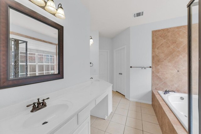 10020 Lachlan Dr, Austin, TX 78717 - full bath featuring a bath, tile patterned floors, a sink, double vanity, and visible vents