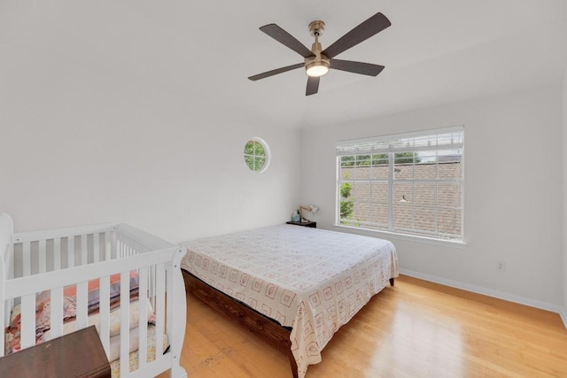 10020 Lachlan Dr, Austin, TX 78717 - bedroom with light wood-style flooring, baseboards, and a ceiling fan