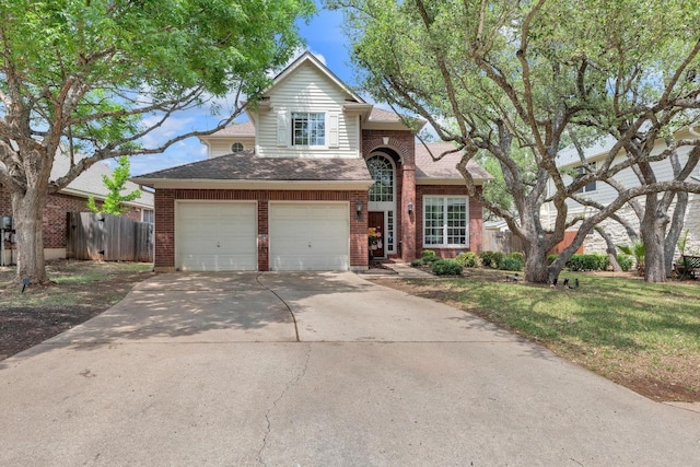 10020 Lachlan Dr, Austin, TX 78717 - traditional home with concrete driveway, brick siding, fence, and a shingled roof
