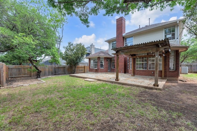 10020 Lachlan Dr, Austin, TX 78717 - rear view of house with a fenced backyard, central air condition unit, brick siding, a patio area, and a lawn