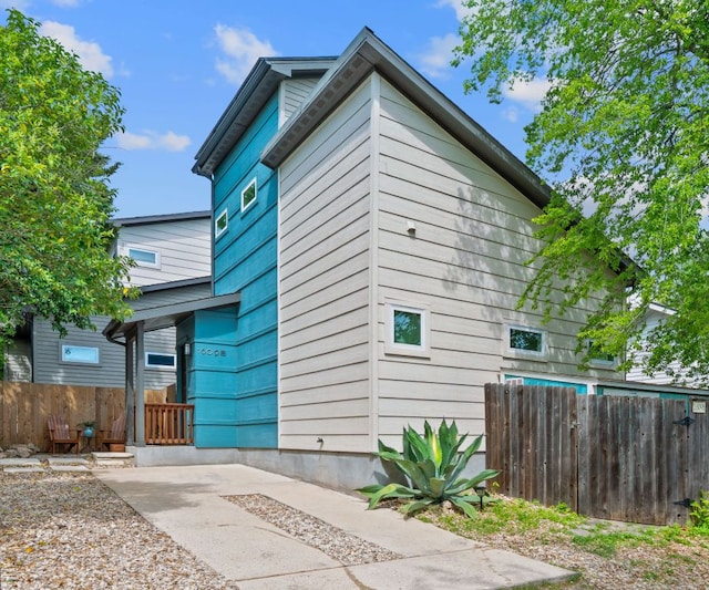 view of property exterior with fence