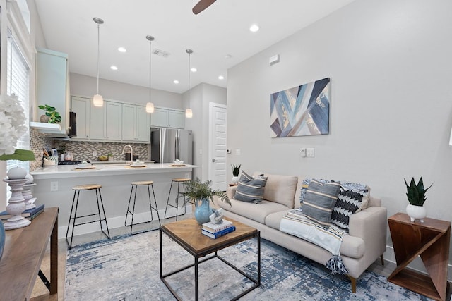 living room featuring recessed lighting and ceiling fan